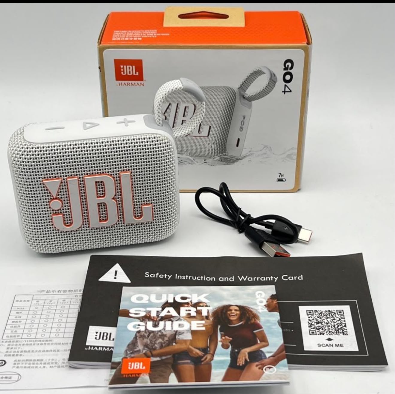 JBL Go 4 blanco con caja, cable y manuales